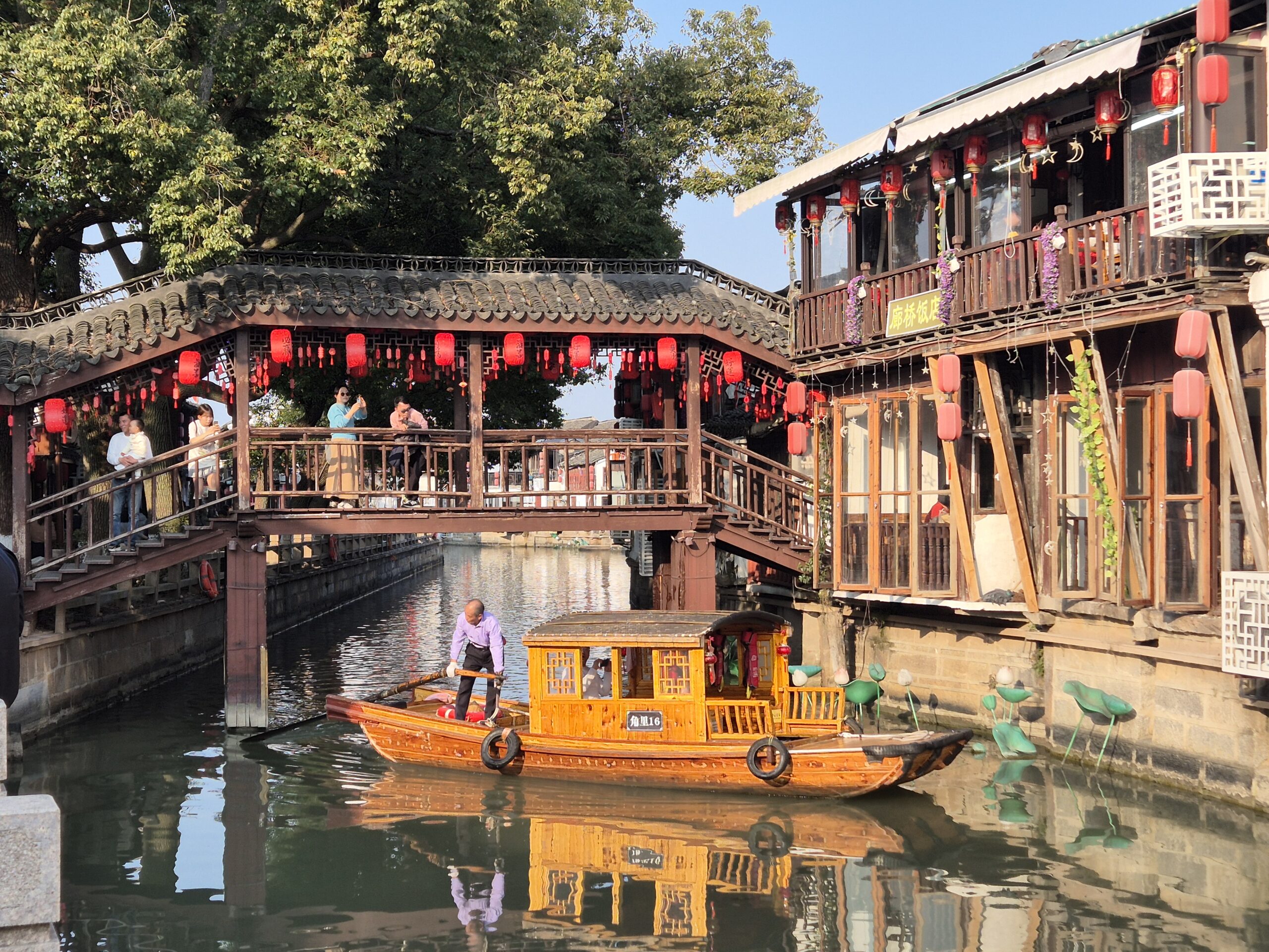 Unique wooden bridge in Zhujiajiao: Traditional covered walkway spanning canal in Shanghai's ancient water town