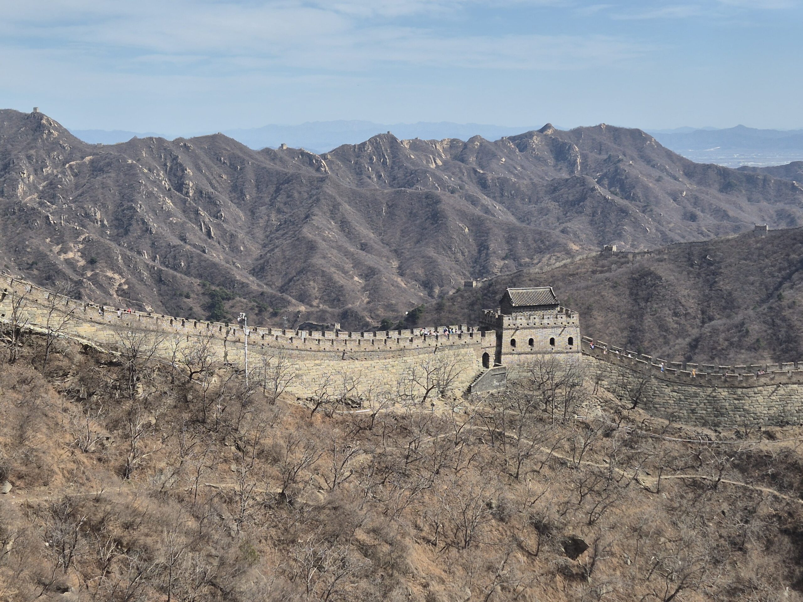 View of the Mutianyu Great Wall near Beijing, a quieter and family-friendly section known for its cable car, toboggan ride, and stunning mountain scenery.