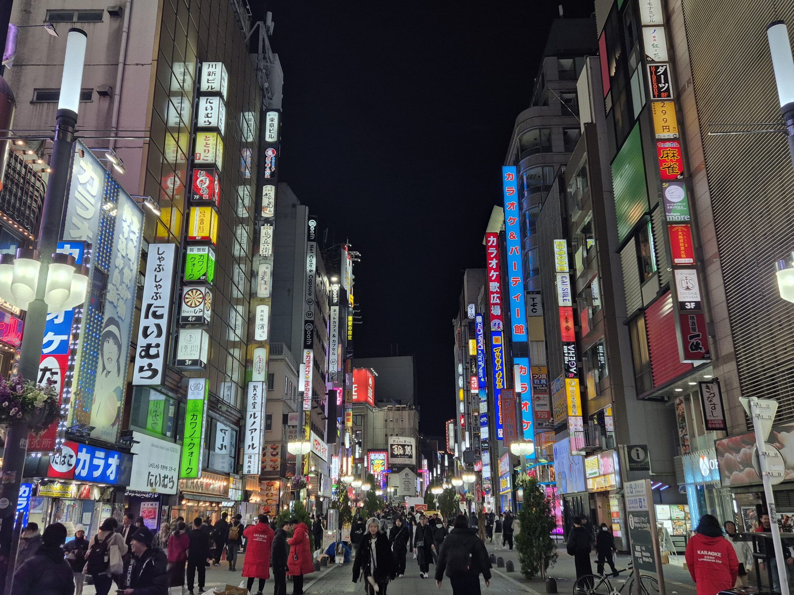 Tokyo neon lights at night, bustling streets and vibrant cityscape