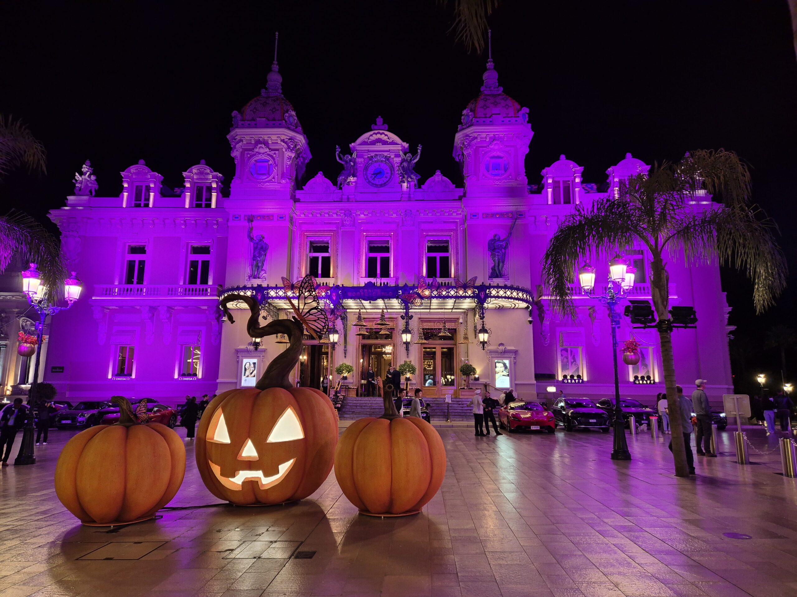 Glowing pumpkins decorating the Monte-Carlo Casino in Monaco - a festive autumn view of one of the top Monaco attractions.